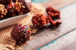 Chocolate Balls On A Wooden Stock Photo