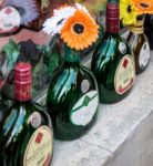 Empty Wine Bottles Being Used A As Vases In Rothenburg Stock Photo