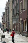 People Walking Down A Street In Poznan Stock Photo