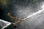 Sprinkler Spraying Water Stock Photo