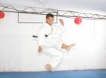 American Man In Karate Suit, Suspended In Mid Air Stock Photo
