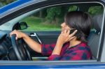 Woman Driving Car Phoning With Mobile Phone Stock Photo