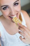 Woman Eating Muesli Bar Snack Stock Photo