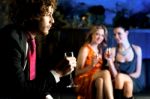 Flirtatious Young Girls Staring At Handsome Guy Stock Photo