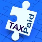 Tax Paid Puzzle Shows Duty Or Excise Payment Stock Photo