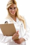 Portrait Of Smiling Female Doctor Holding Clipboard Stock Photo