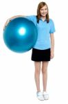 Slim And Fit Teen Girl Holding A Swiss Ball Stock Photo