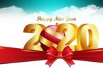 2020 Happy Newyear. Golden Letter Decorated With Ribbon Stock Photo