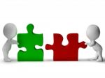 Jigsaw Pieces Being Joined Shows Teamwork And Collaboration Stock Photo