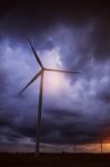 Wind Turbines With A Dark Sky Stock Photo