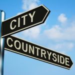 City Or Countryside Directions On A Signpost Stock Photo