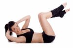 Fitness Instructor Doing Situp Exercise And Turning To Camera Stock Photo