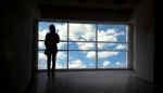 Women Silhouette Beside The Big Window And Sky Background Stock Photo