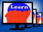 Learn On Brain On Monitors Showing Human Studying Stock Photo