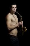 Young Men With Saxophone Stock Photo