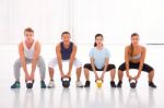 Multiethnic Group Of People Doing Kettlebell Crossfit Exercise Stock Photo