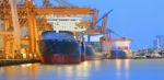 Panorama Scene Of Ship Yard With Heavy Crane In Beautiful Twilig Stock Photo
