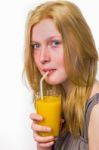 Blonde Girl Drinking Juice With Straw Stock Photo