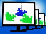Unfinished Puzzle On Monitors Showing Strategy Stock Photo