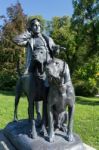 Statue Of A Man And Two Dogs At The Imperial Kaiservilla In Bad Stock Photo