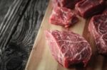 Raw Angus Beef Slices On The Wooden Board  Horizontal Stock Photo