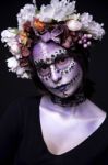 Halloween Model With Rhinestones And Wreath Of Flowers Stock Photo