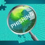 Phishing Magnifier Represents Malware Hacker And Hacked Stock Photo