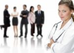Female Doctor With Business People Stock Photo