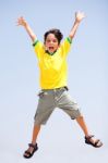 Smart Kid Jumping High In Air Stock Photo
