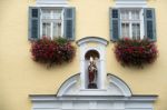 Statue Of A Bishop On A Wall In St Wolfgang Stock Photo