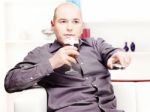 Man Relaxing At Home With Beer Stock Photo