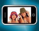 Girls Wearing Hats On Mobile Stock Photo