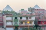 Houses In Cairo And Pyramids Of Giza At The Background Stock Photo