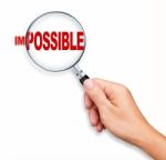Changing Impossible Into Possible By Magnifying Glass Stock Photo