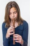 Teenage Girl Playing The Flute Stock Photo