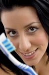 Close Up Of Woman Showing Toothbrush Stock Photo
