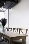 Wooden Dining Table In Coffee Shop Stock Photo