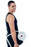 Fitness Man With Weighing Scale Stock Photo
