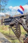 Military Machine Gun With Bullets And Dutch Flag Stock Photo