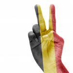 Flag Of Belgium On Victory Hand Stock Photo