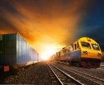 Industry Container Trainst Running On Railways Track Against Bea Stock Photo