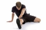 Man doing Stretching exercise Stock Photo