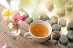 Hot Tea In White Cup With Flowers On Wooden Pebble Stone Water B Stock Photo