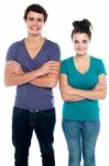 Teenage Couple With Crossed Arms Stock Photo