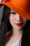 Portrait Close Up Of Beautiful Asian Woman Model In Orange Strip Stock Photo