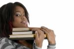 Girl Keeping Her Chin On Books Stock Photo