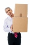 Aged Man Holding Cardboard Boxes Stock Photo