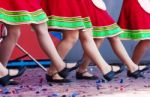 Russian Girls In Traditional Costumes Dancing On Stage Stock Photo