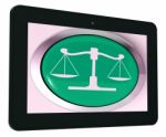 Scales Of Justice Tablet Means Law Trial Stock Photo