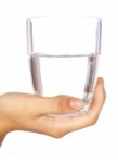 Hand Holding Glass Of Water Stock Photo